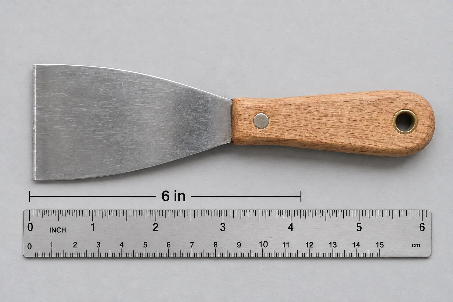 6-inch putty knife blade, a standard hardware store size 6-inch putty knife blade, a standard hardware store size